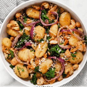 Sheet pan gnocchi with white beans, kale and red onions in a bowl.