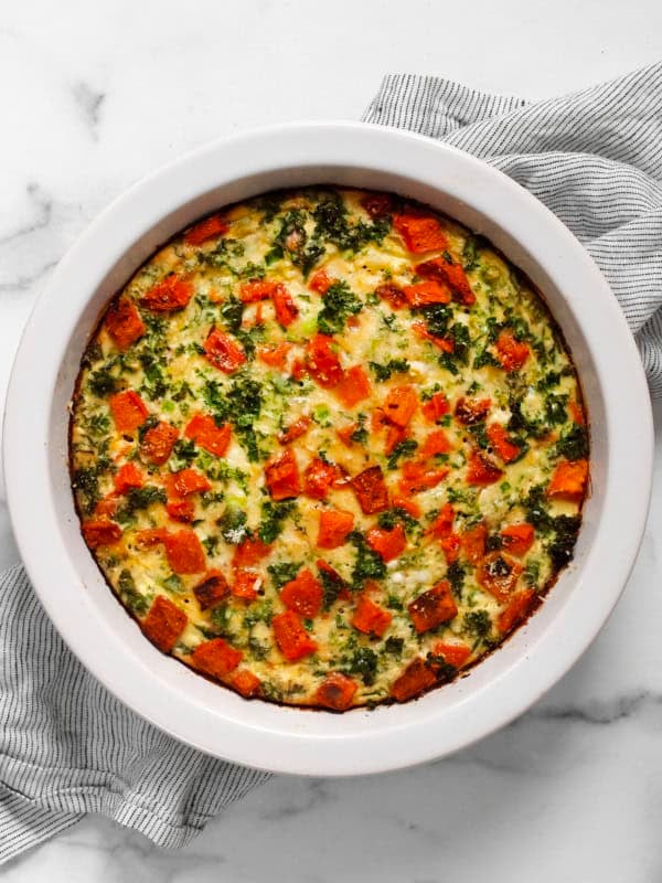 Roasted sweet potato cottage cheese egg bake in a pie dish.