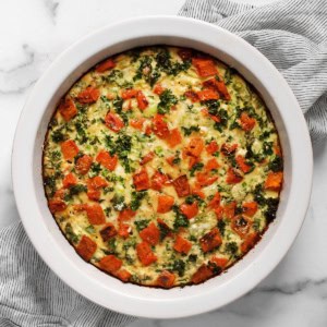 Roasted sweet potato egg bake in a pie dish.