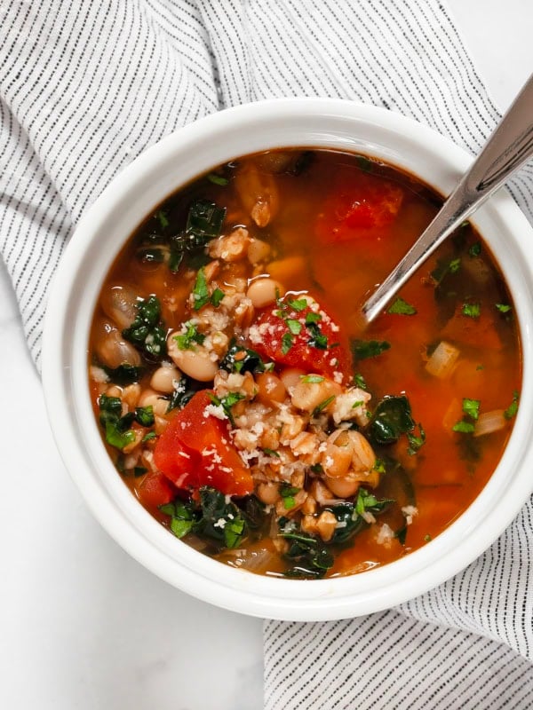 Bowl of tomato white bean farro soup.
