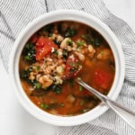 Bowl of tomato white bean farro soup.