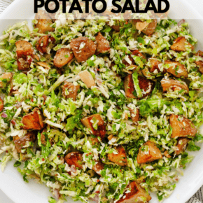 Shredded brussel sprout salad with roasted potatoes on a plate.