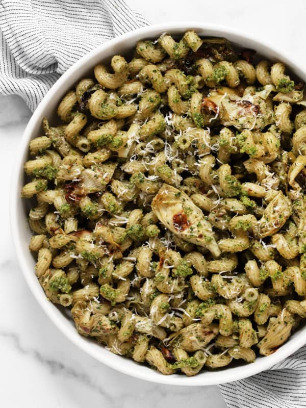 Spinach artichoke pasta in a bowl.