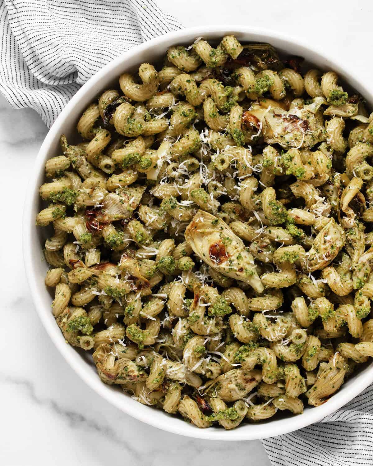 Spinach artichoke pasta in a bowl.