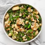 Roasted asparagus cauliflower salad in a bowl.