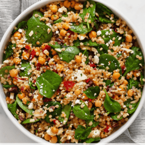 Mediterranean couscous salad in a serving bowl.