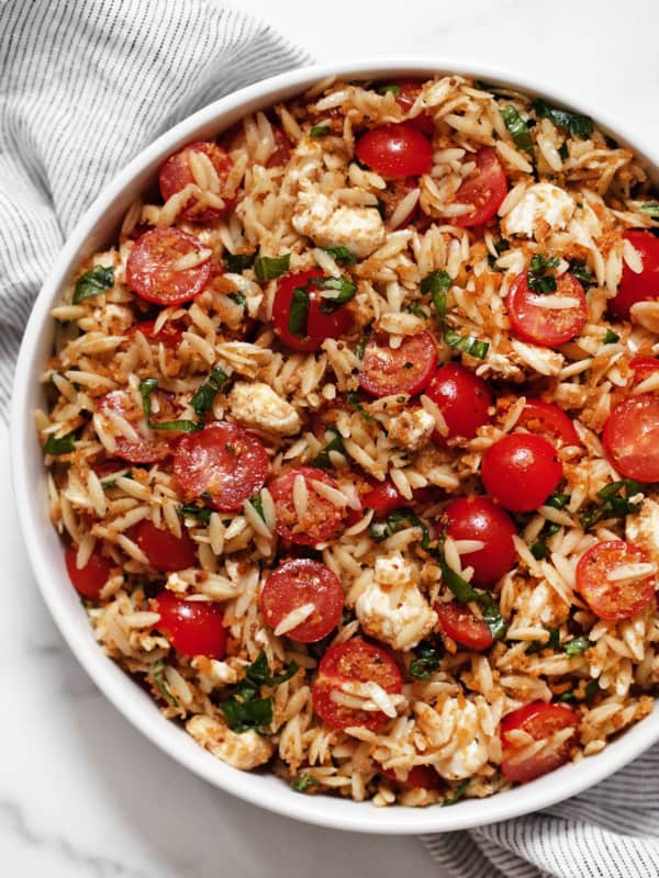 Caprese orzo pasta salad in a bowl.