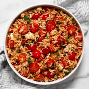 Caprese orzo pasta salad in a bowl.