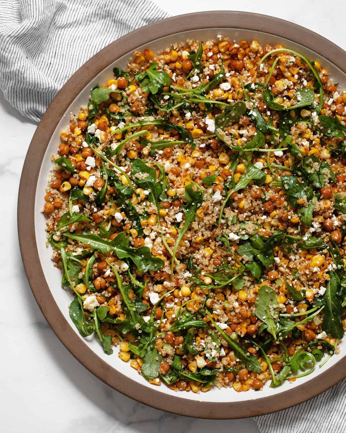 Roasted corn chickpea quinoa salad in a large bowl.
