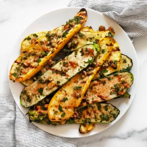 Grilled zucchini and squash on a plate.