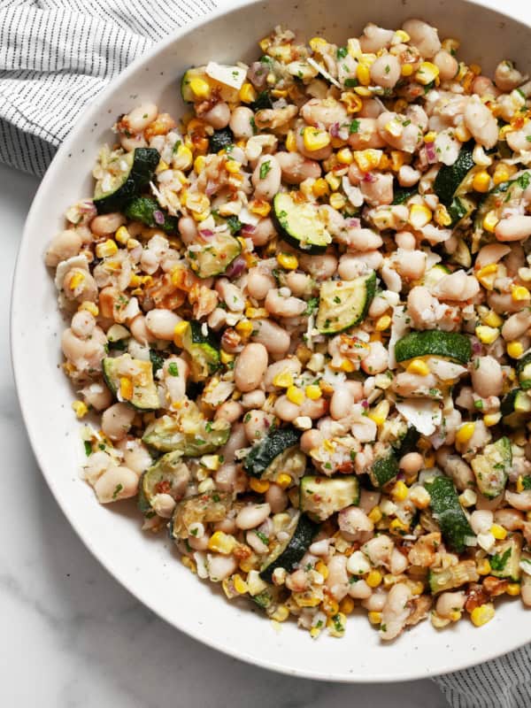 Roasted corn & zucchini salad in a bowl.
