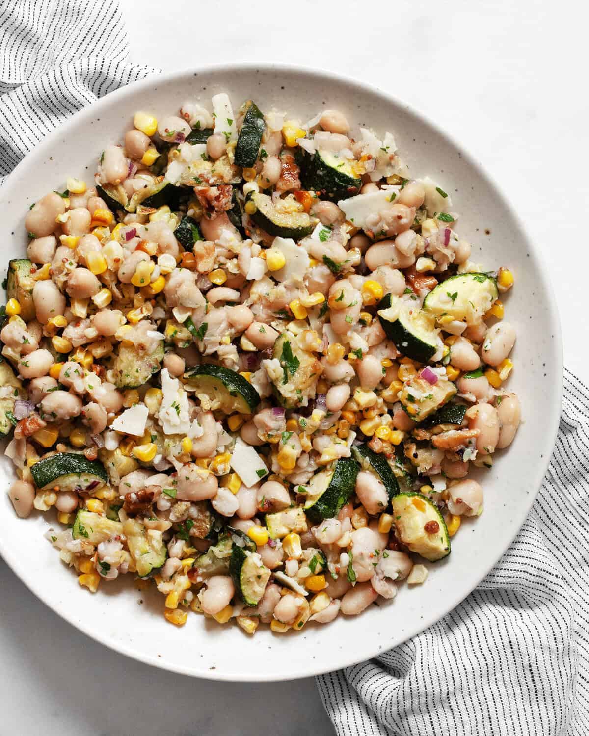 Roasted corn & zucchini salad in a bowl.