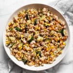 Roasted corn & zucchini salad in a bowl.