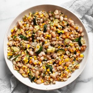 Roasted corn & zucchini salad in a bowl.