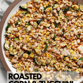 Roasted corn zucchini white bean salad on a large serving plate.